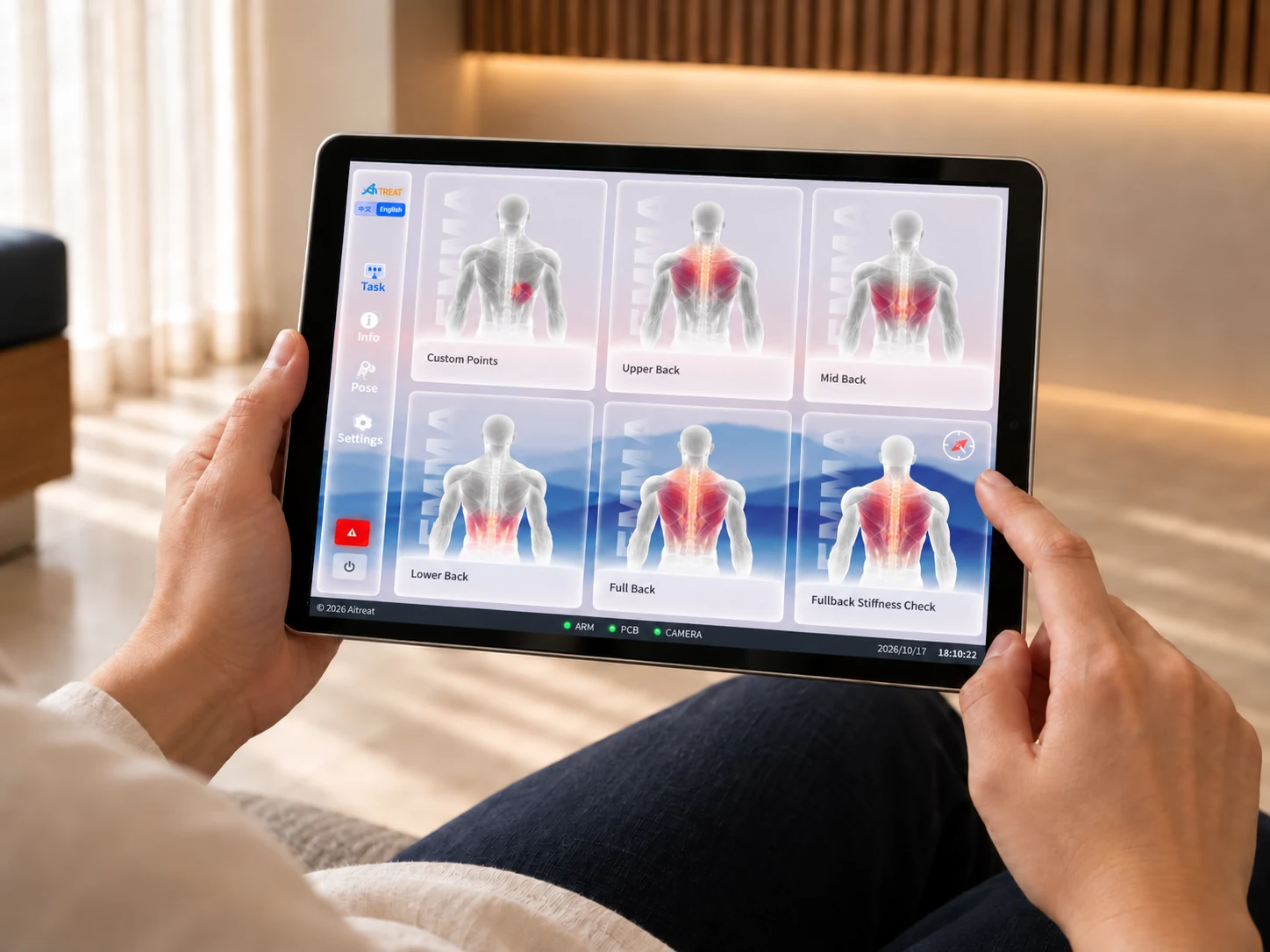 A therapist selects treatment options on EMMA’s control panel.